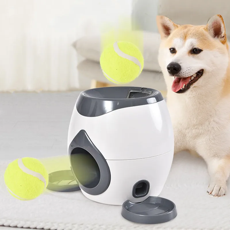 Automatic dog treat dispenser and ball launcher toy for puppy training.